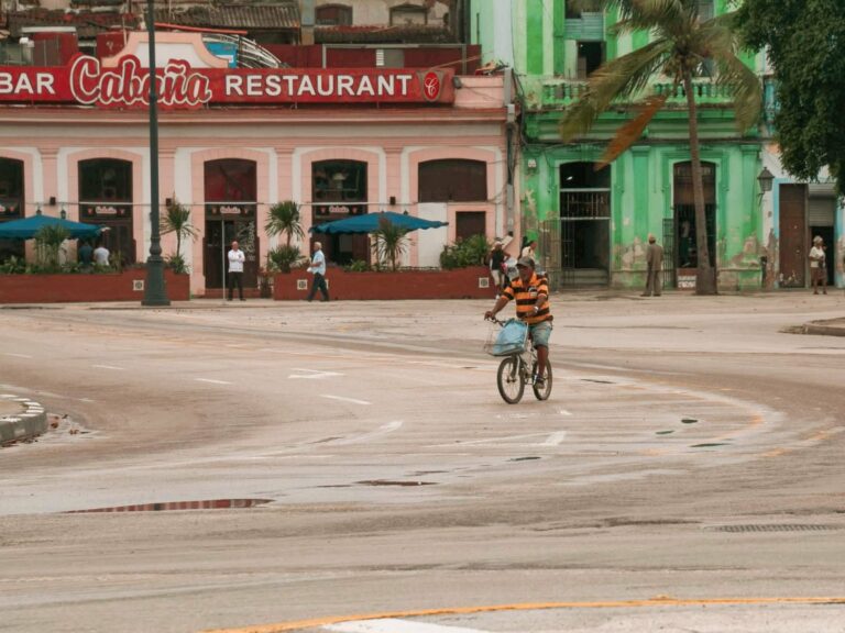 A cyclist on a colourful Cuban street