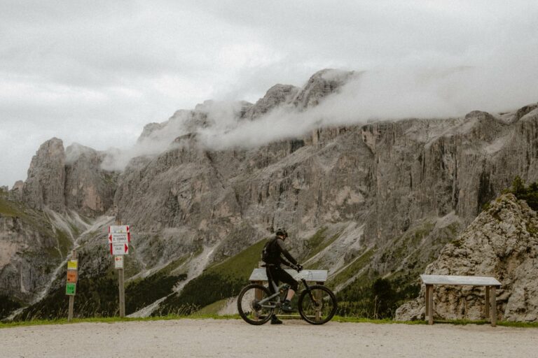 A cyclist on a mountain road in the Dolomites