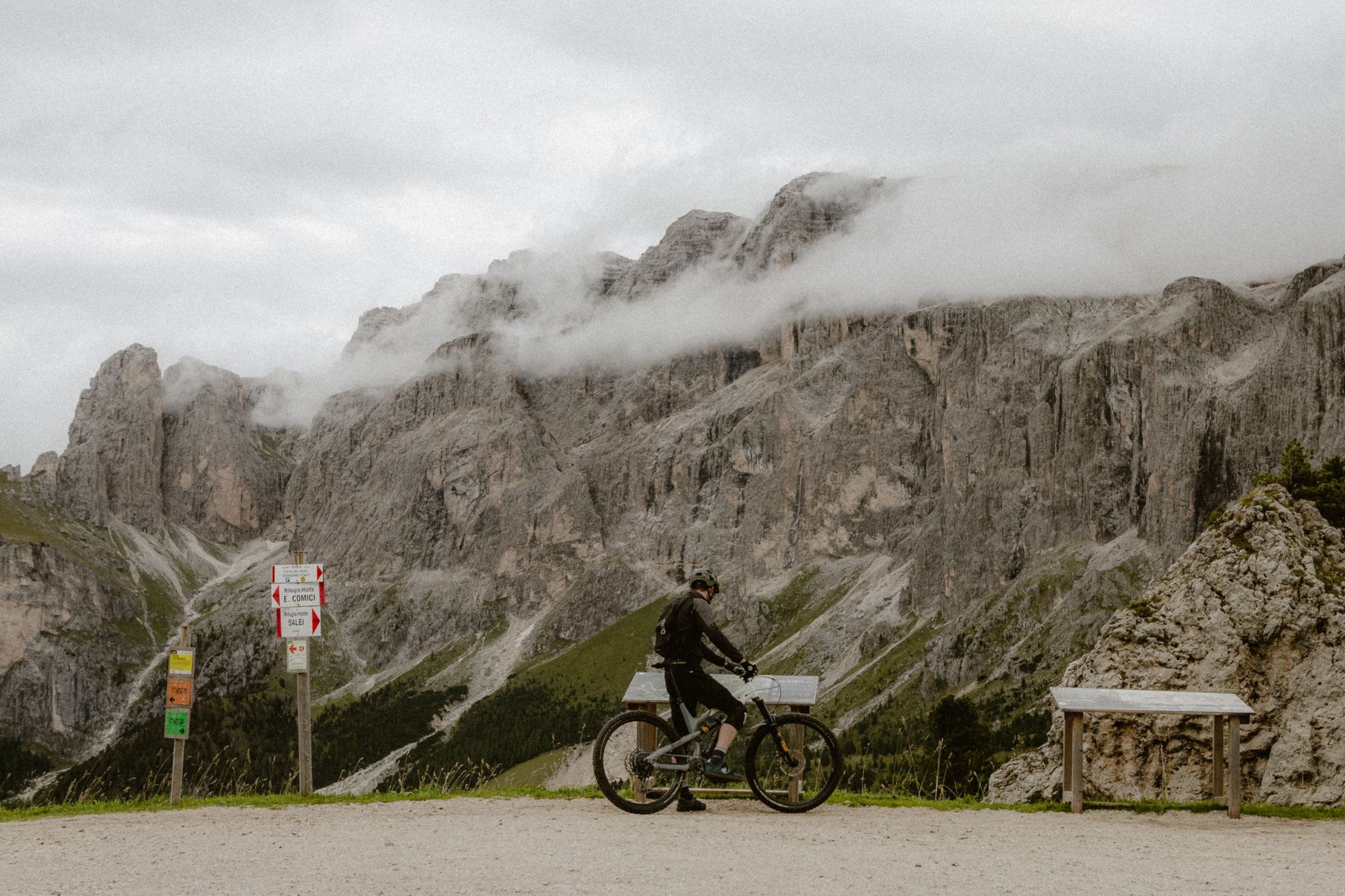 A cyclist on a mountain road in the Dolomites