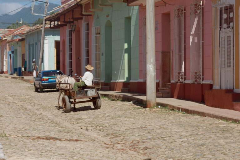 A horse-drawn cart on a cobbled street in Trinidad, Cuba