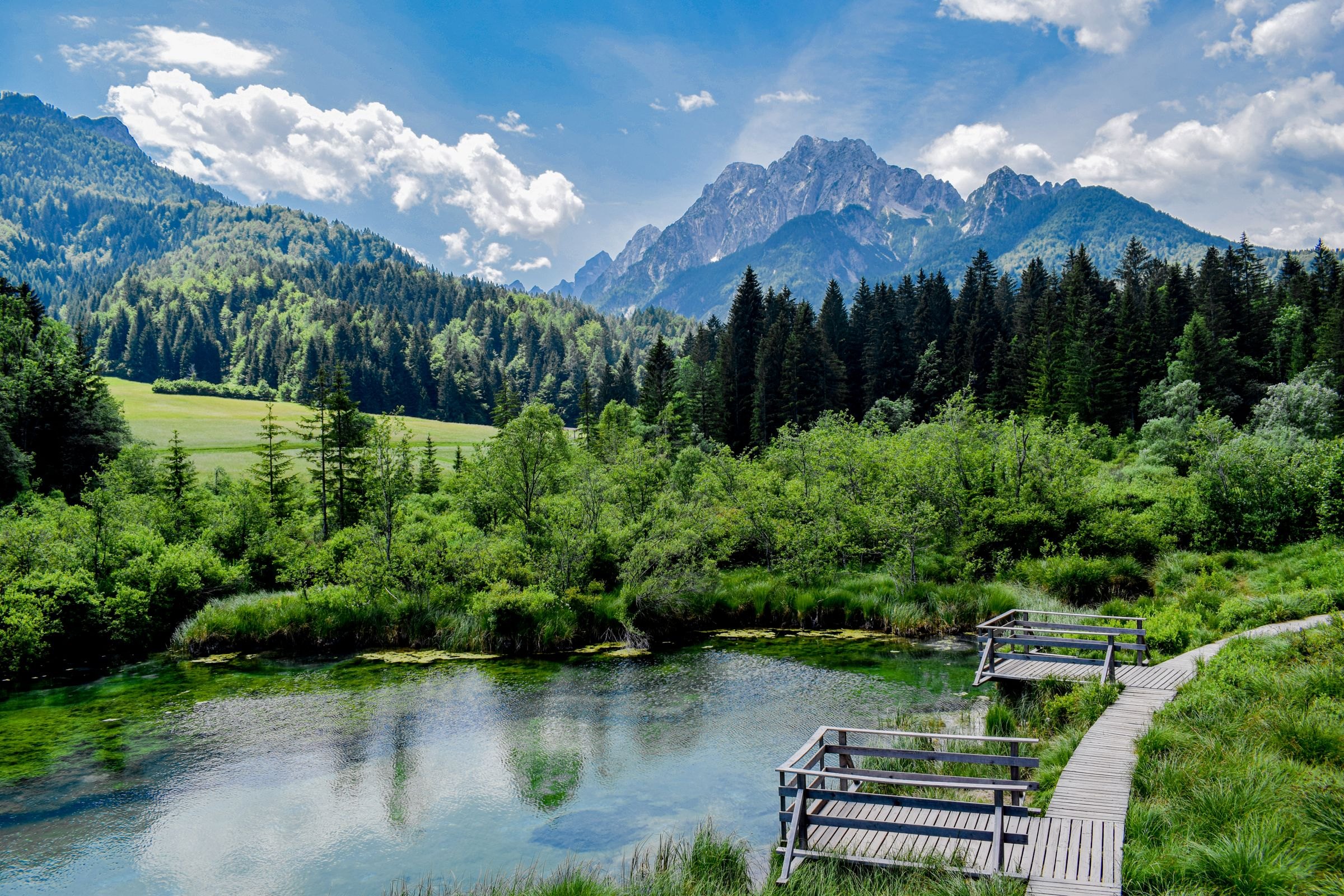 A mountain lake and boardwalk in the Julian Alps