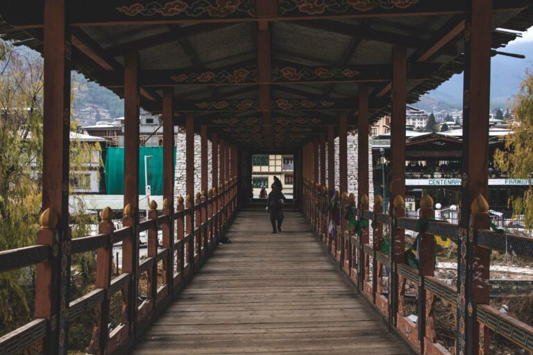 A traditional covered wooden bridge in Thimphu
