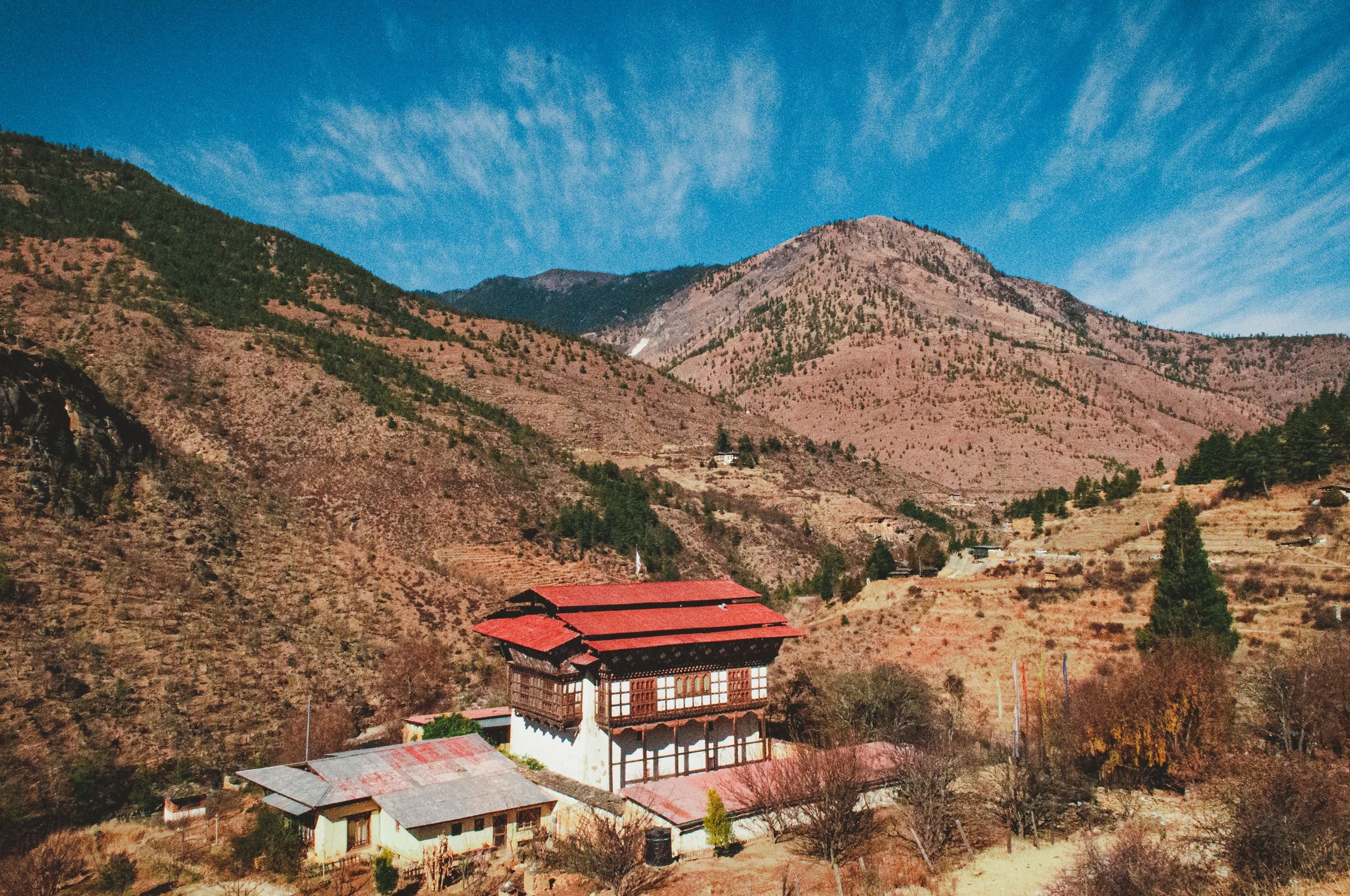 A traditional house in a mountain valley in Bhutan