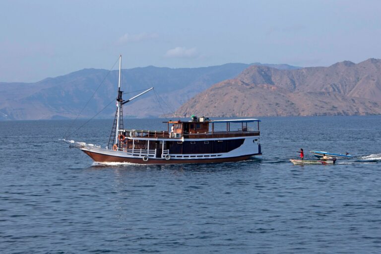 A traditional phinisi boat under sail