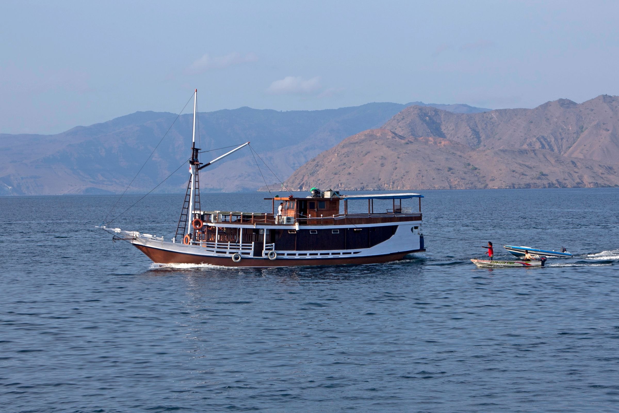 A traditional phinisi boat under sail
