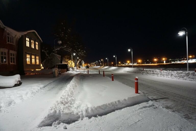 A snowy street in Akureyri at night