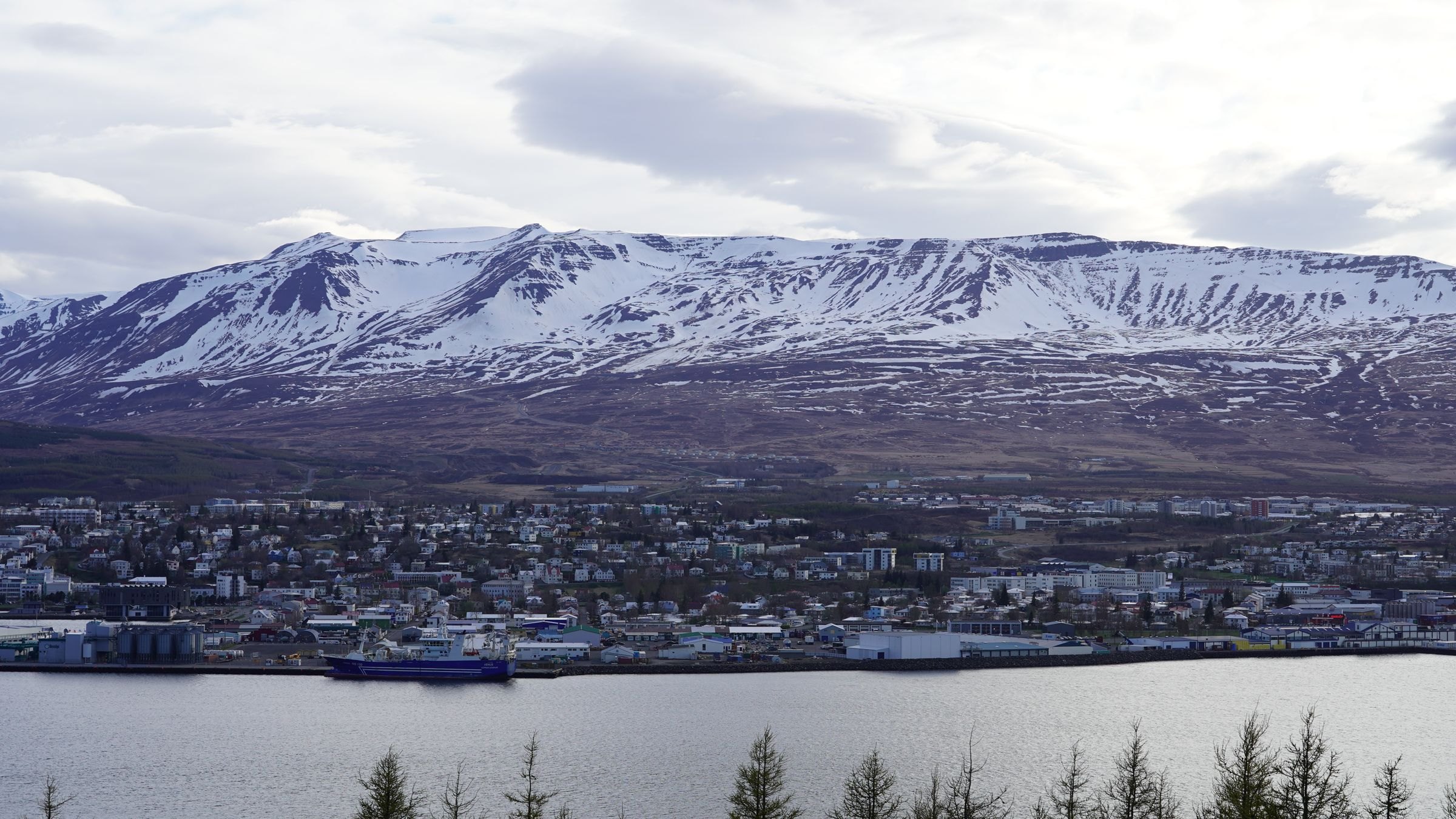 Akureyri beneath snow-capped mountains