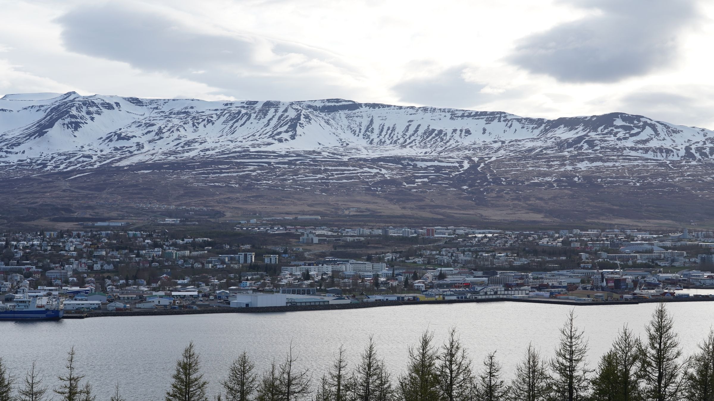Akureyri below snowcapped mountains