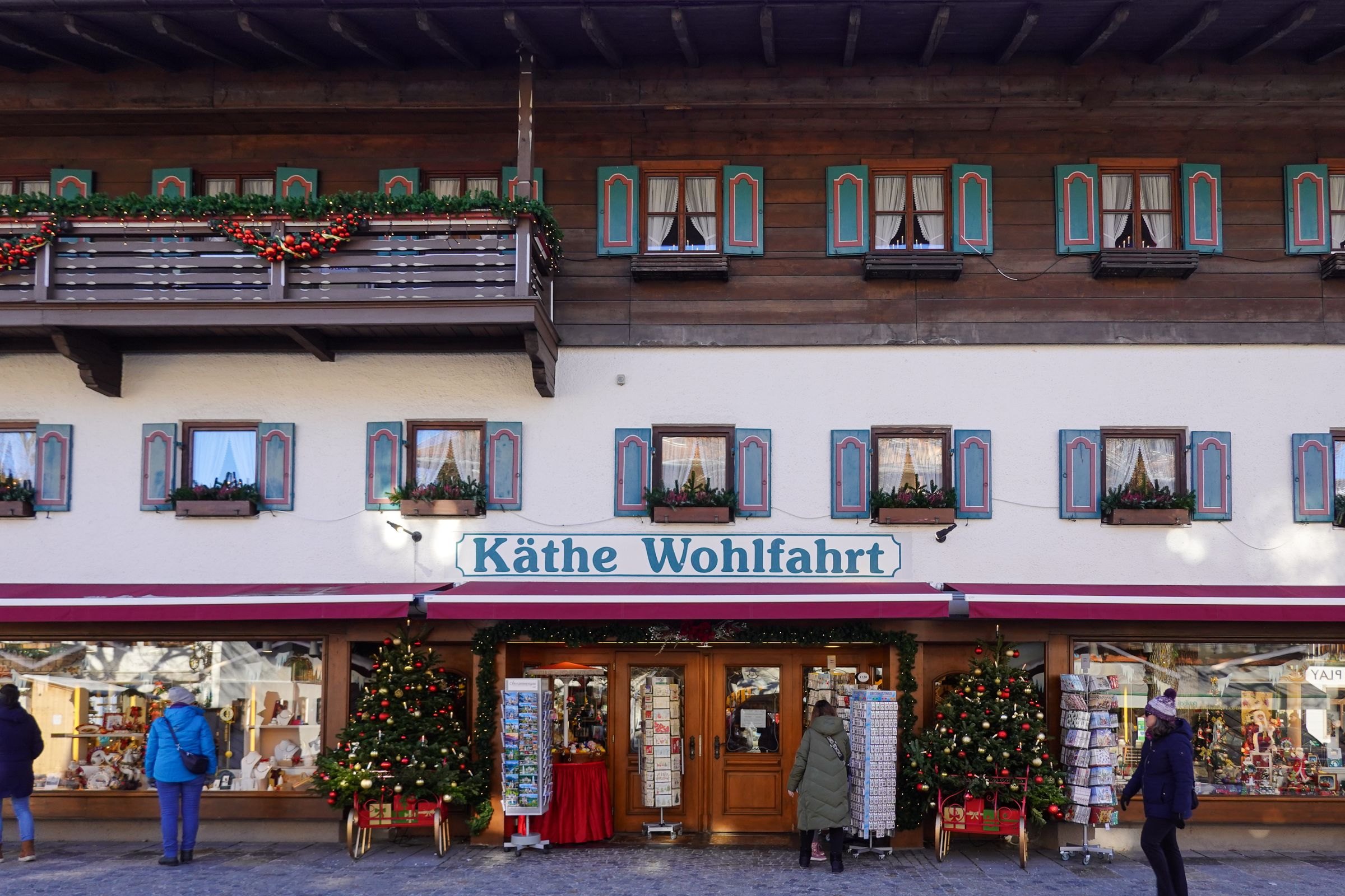 A festively decorated shop in an Alpine village