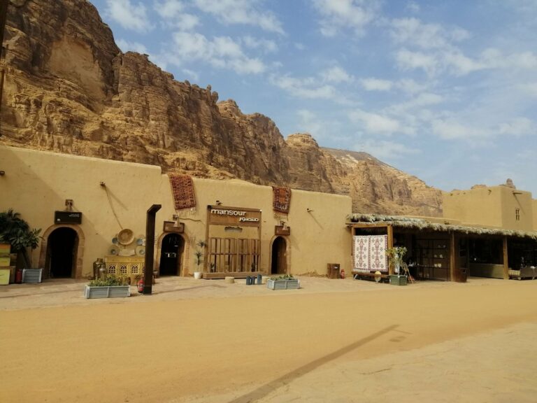Adobe buildings below the cliffs of AlUla