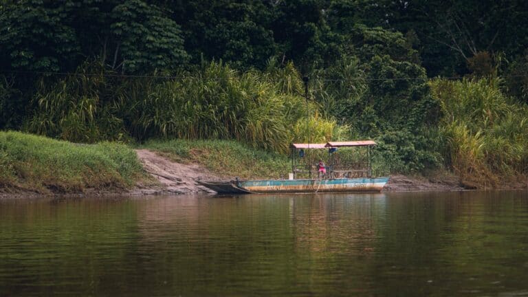 A boat moored on a riverbank in the Peruvian Amazon