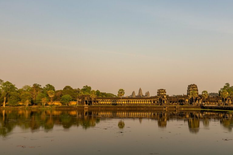 Angkor Wat reflected in its pond at sunrise, Cambodia