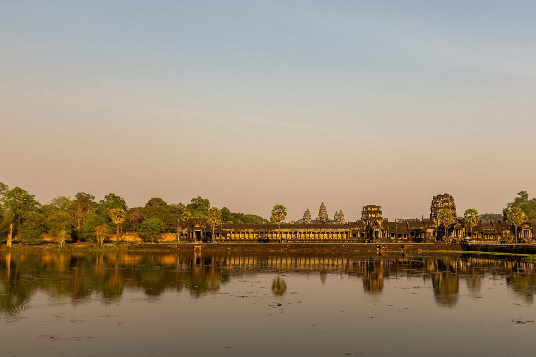 Angkor Wat reflected in its pond at sunrise, Cambodia