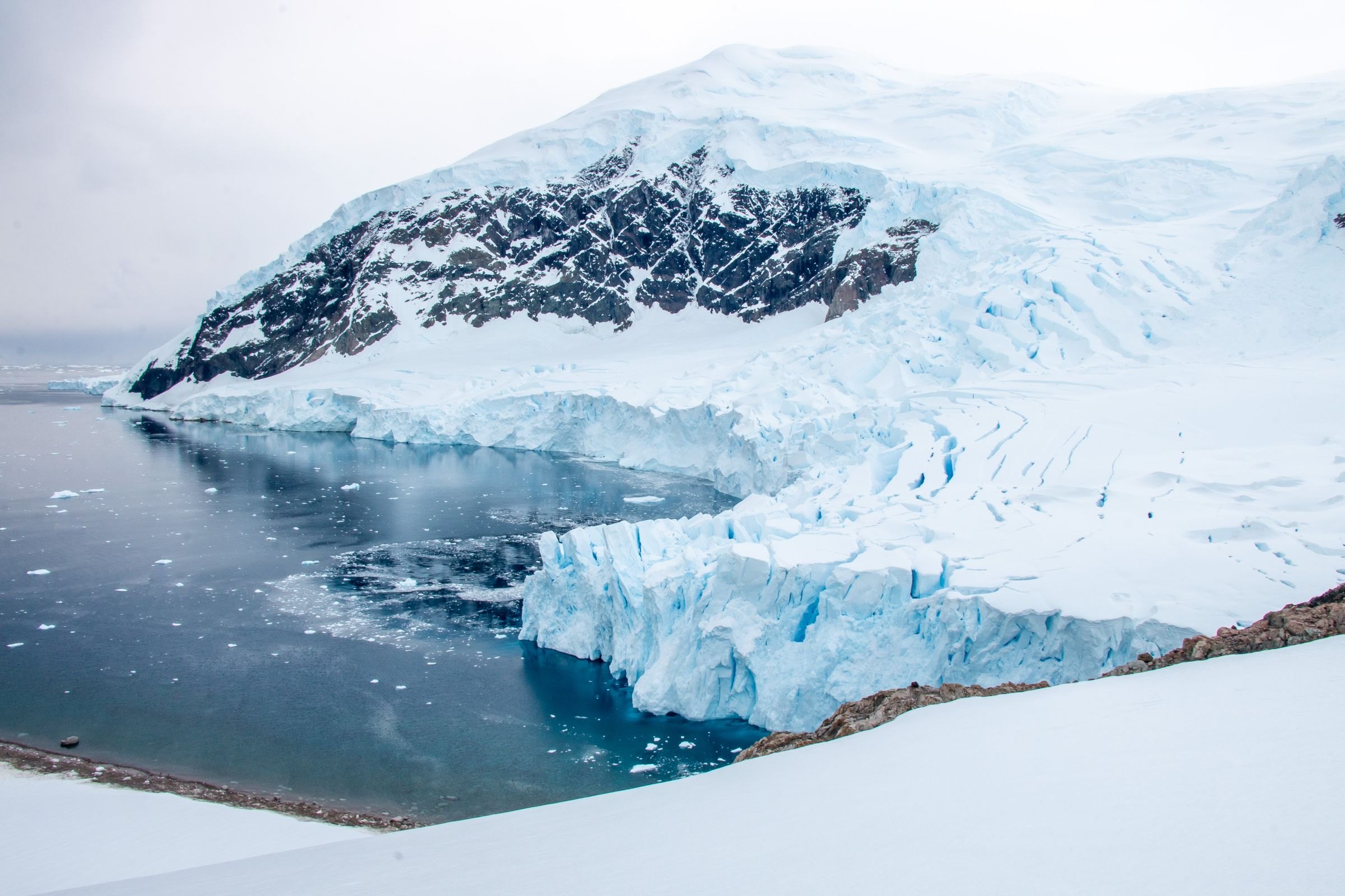Ice cliffs and still water in Antarctica