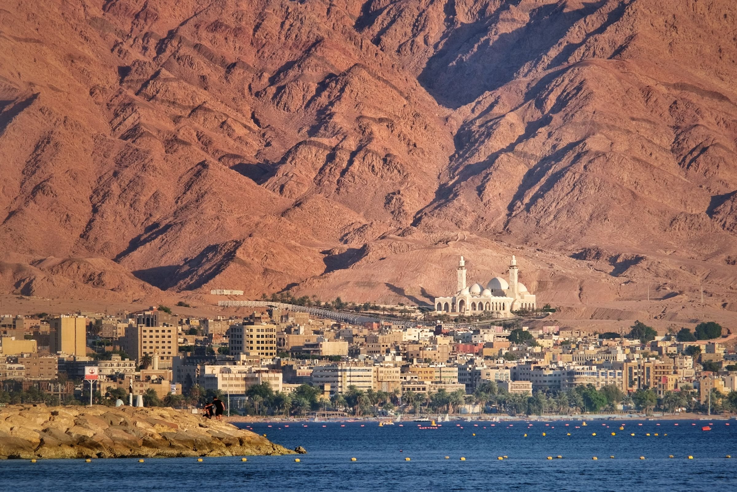 Aqaba below its red mountains