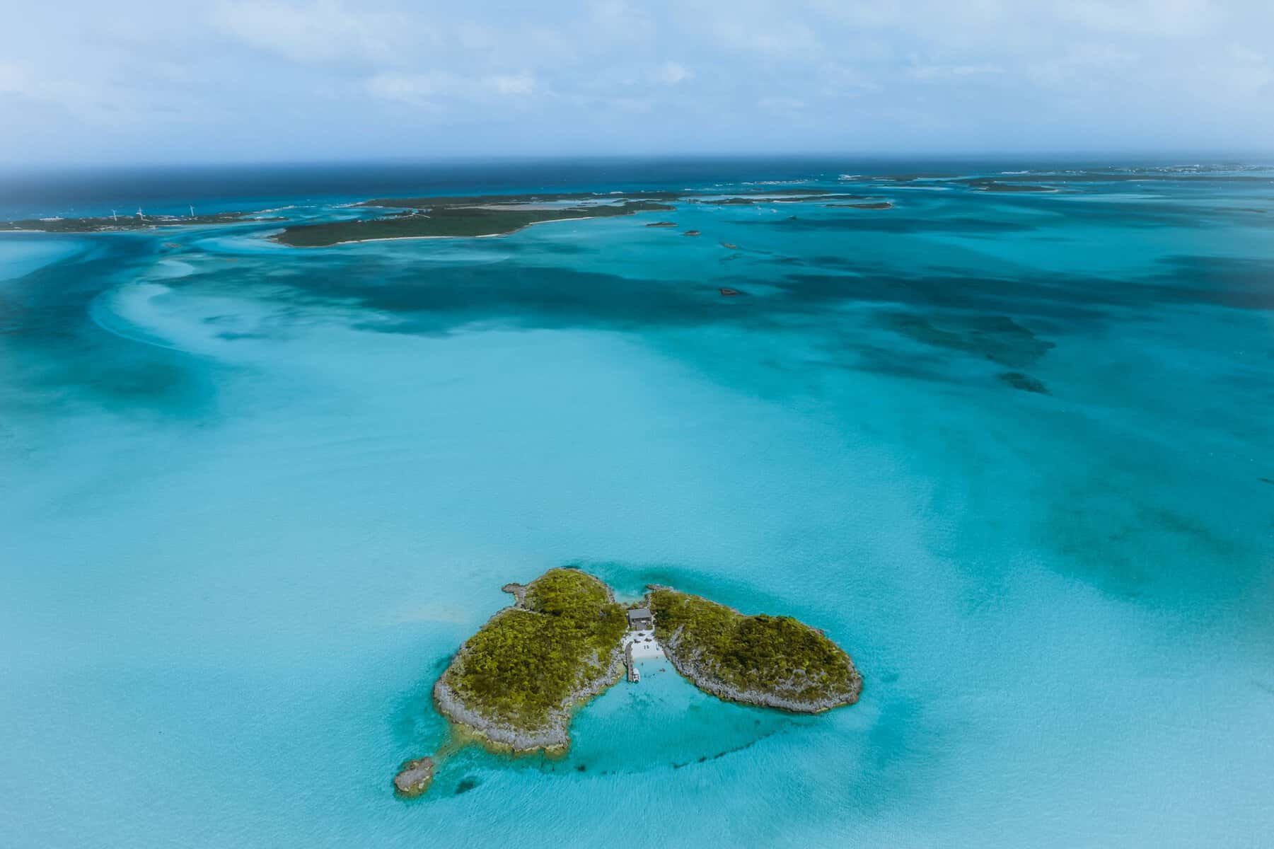 Aerial view of a small tropical island surrounded by clear water
