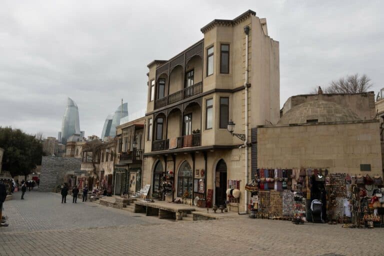 Historic buildings in Baku with the Flame Towers behind