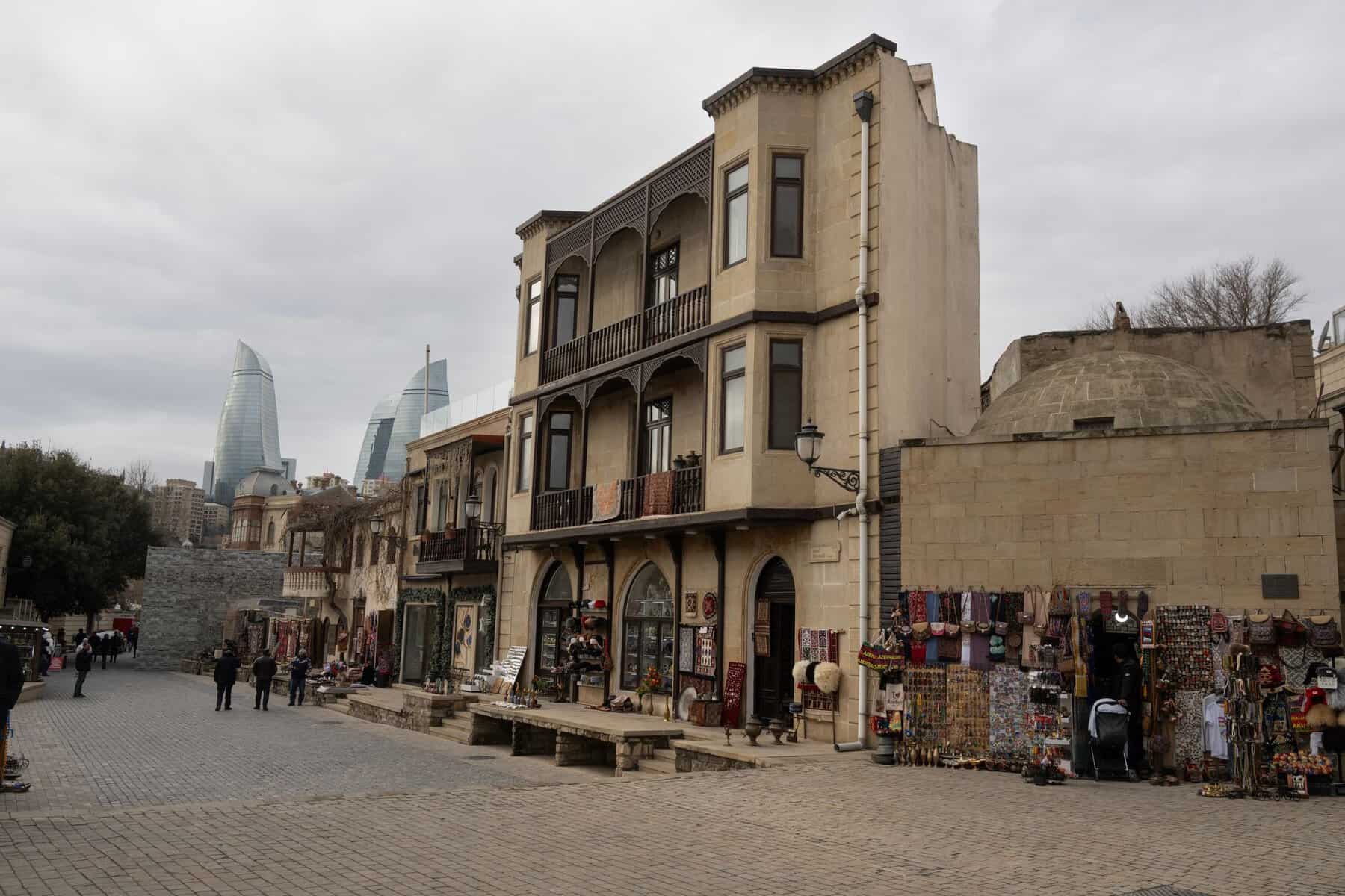 Historic buildings in Baku with the Flame Towers behind