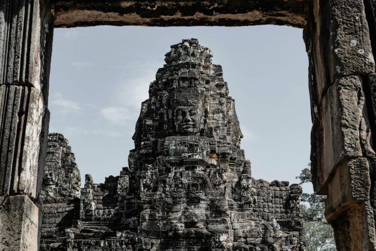 A stone face tower at Bayon Temple