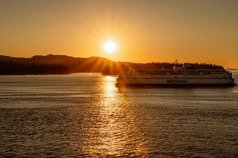 A BC Ferries ship sailing at sunset