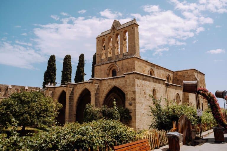 The Gothic ruins of Bellapais Abbey among cypress trees, North Cyprus