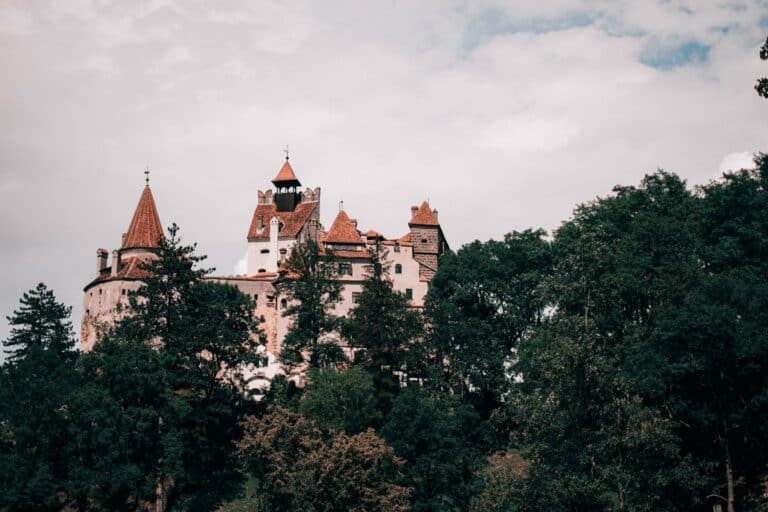 Bran Castle above the forest in Transylvania, Romania