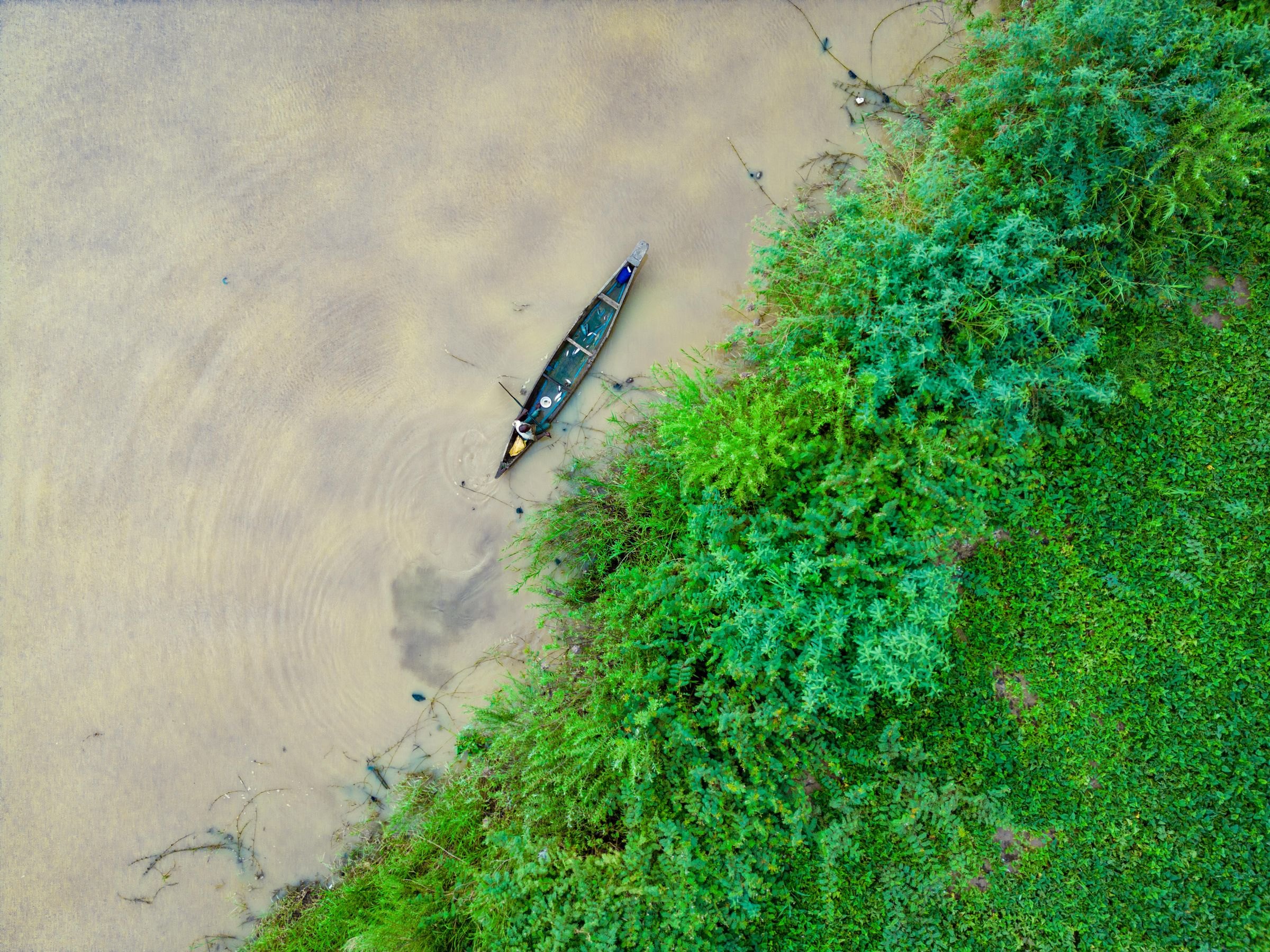 A canoe on a river from above