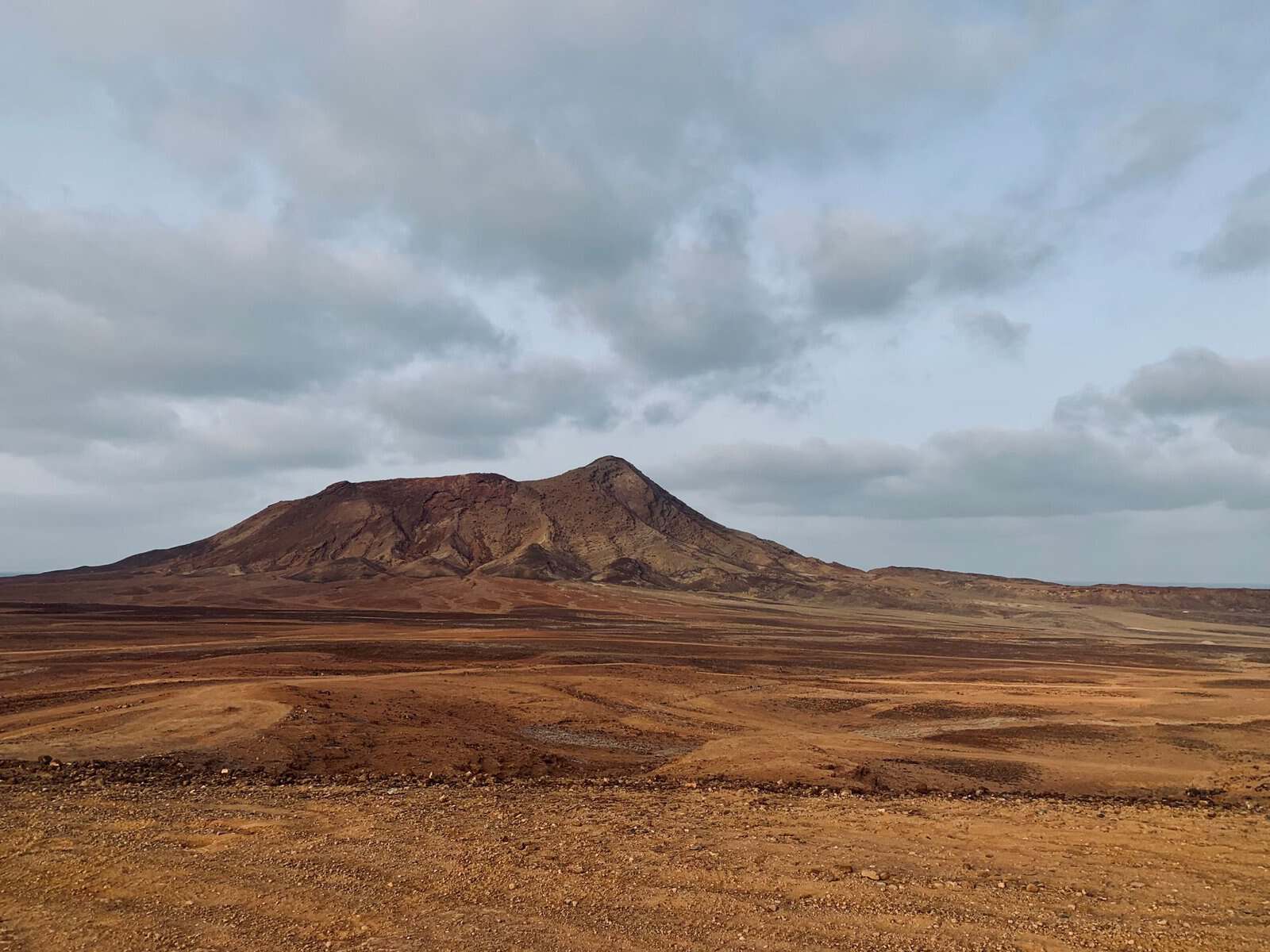 A dramatic volcanic mountain under cloud on Sal, Cape Verde