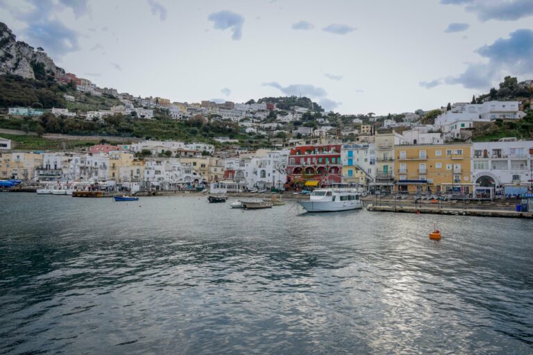Colourful buildings and boats in the harbour of Capri
