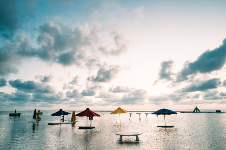 Colourful parasols in the sea off Caye Caulker