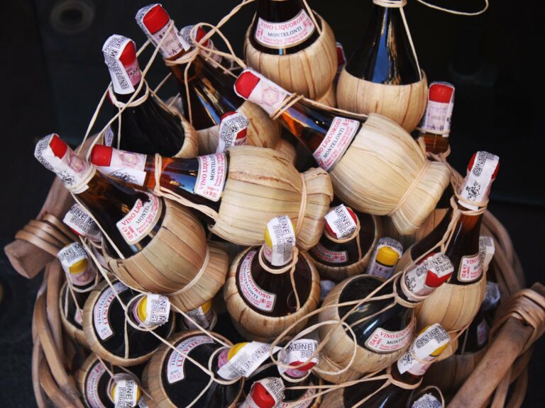Traditional Chianti wine bottles in straw baskets