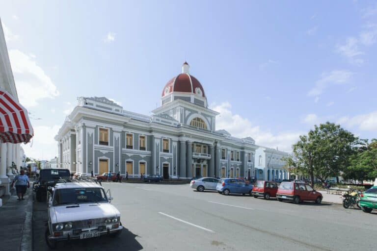A historic building with a red dome in Cienfuegos, Cuba