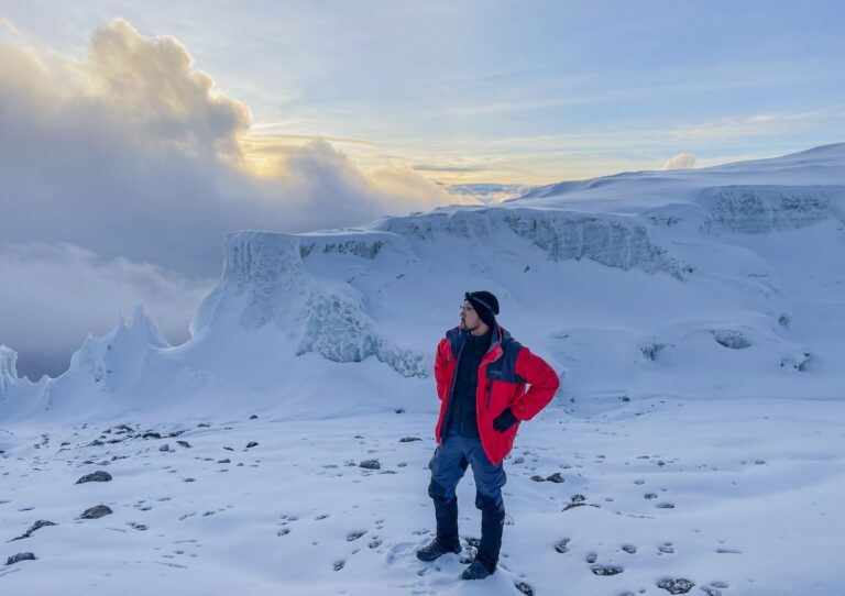 A climber beside the glaciers near the summit of Kilimanjaro