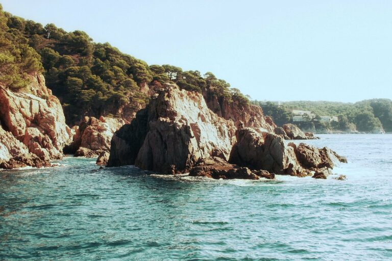 Rocky cliffs above a clear sea on the Costa Brava