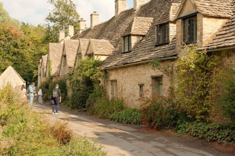 Stone cottages lining a quiet Cotswold street
