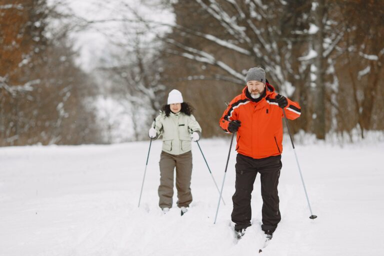 Cross-country skiing through a snowy forest