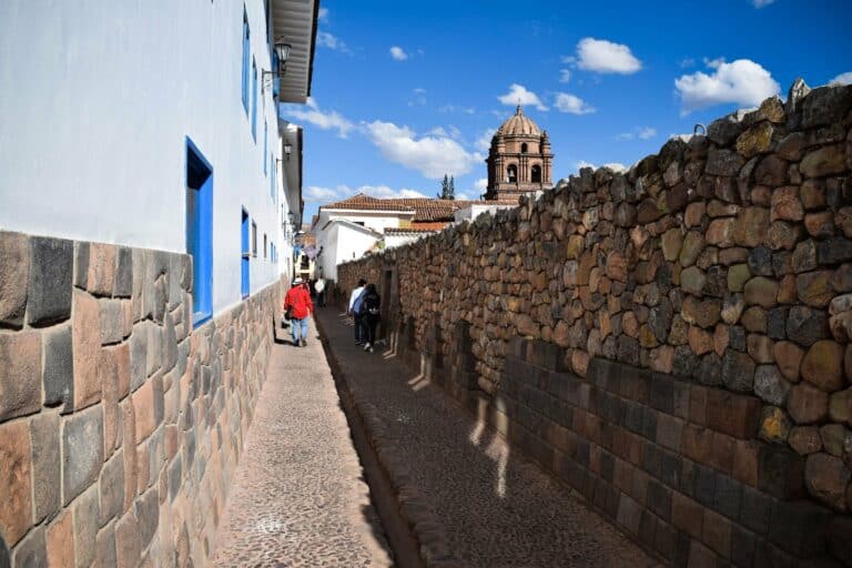 A narrow Cusco street lined with Inca stone walls, Peru