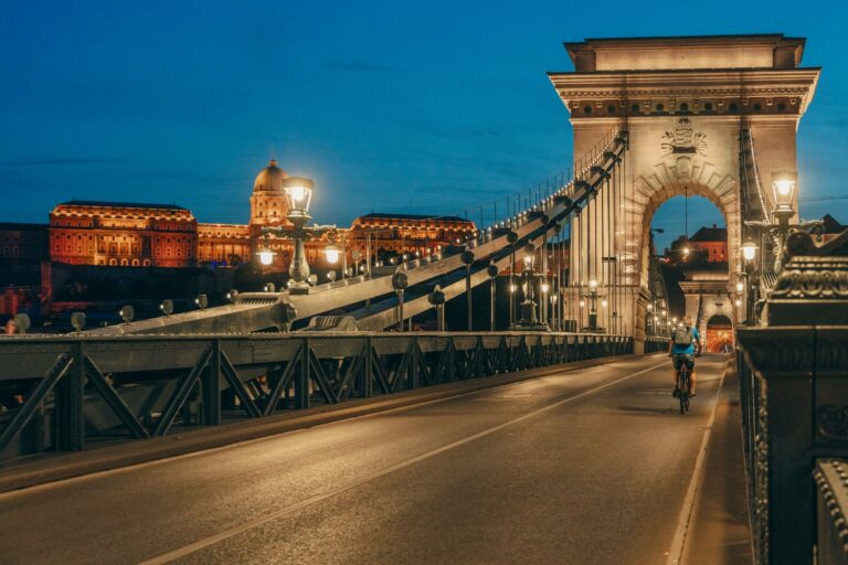 A cyclist crossing the Chain Bridge in Budapest