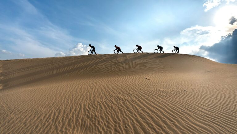 Cyclists on a desert ridge