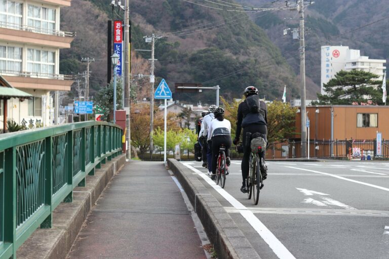 Cyclists on a quiet street in Japan