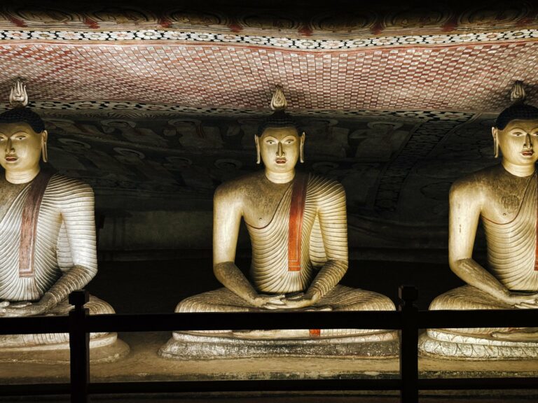 Illuminated Buddha statues in the Dambulla cave temple