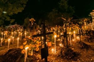 Candles lighting graves on the Day of the Dead