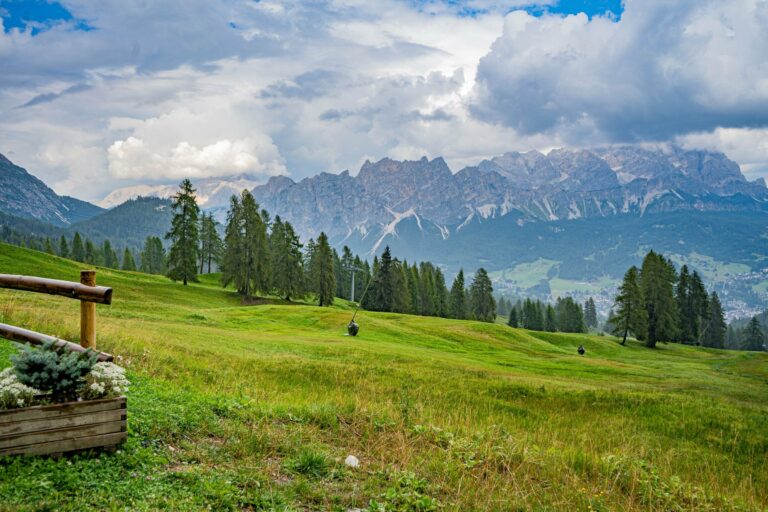 Green meadows below the Dolomites