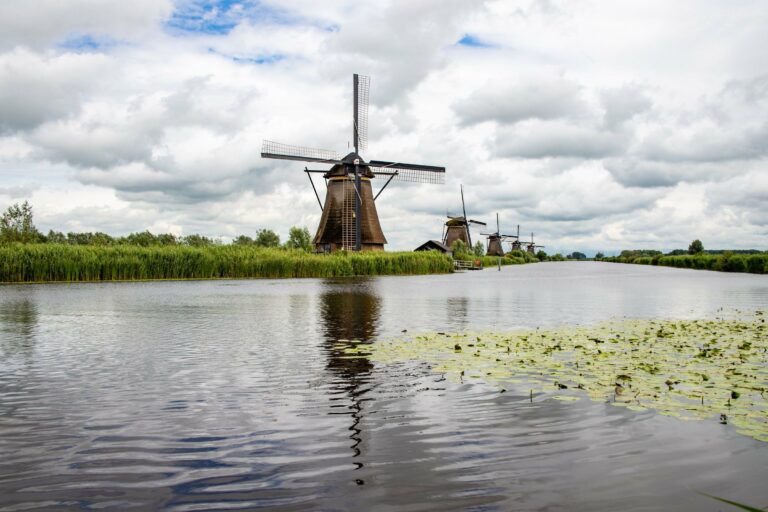 Historic Dutch windmills along a river