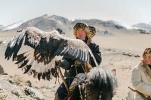A Kazakh eagle hunter with his golden eagle
