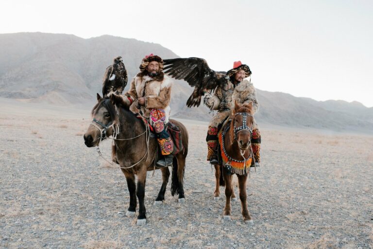Eagle hunters on horseback in western Mongolia