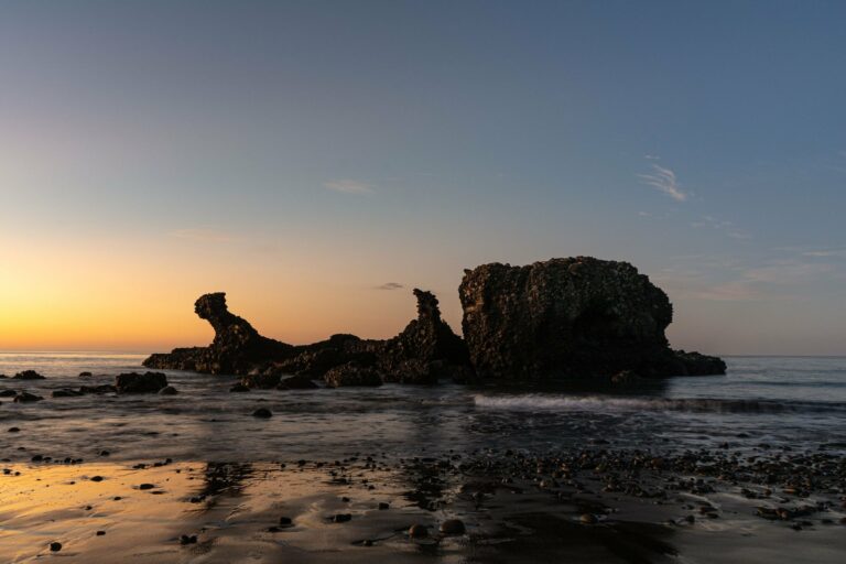 The rock at El Tunco beach at sunset