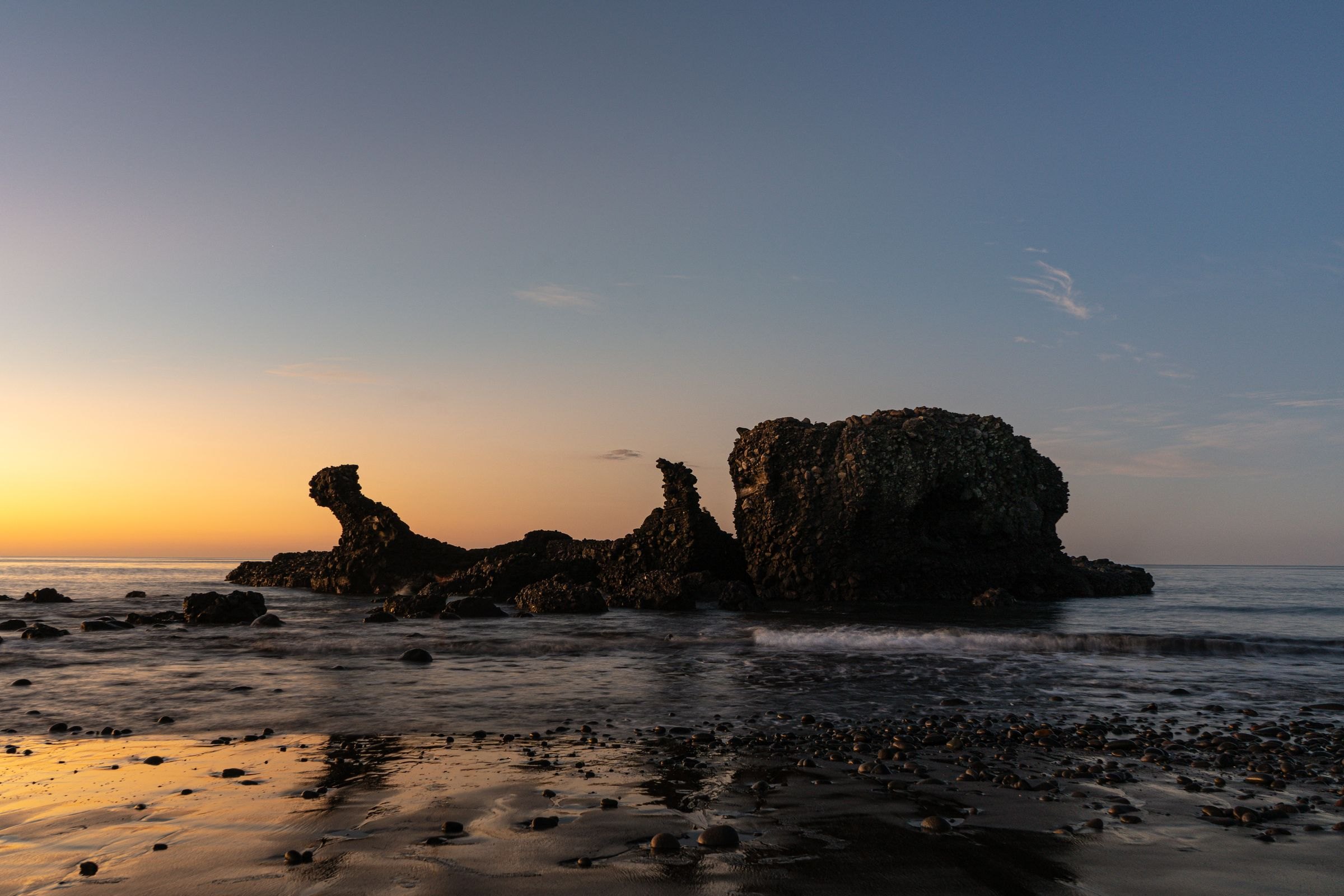 The rock at El Tunco beach at sunset