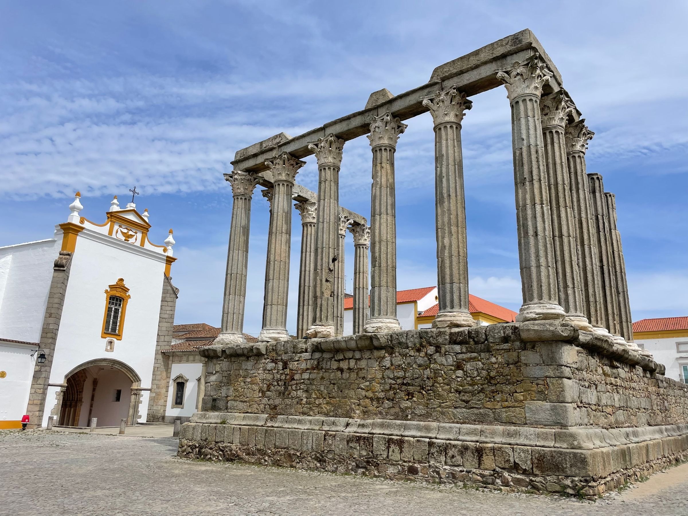 The Roman temple and a baroque church in Evora