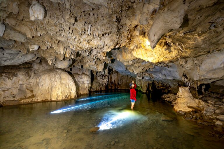 Exploring a limestone cave by boat in Palawan